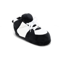 Black and white striped plush sneaker slippers with a bold graphic look